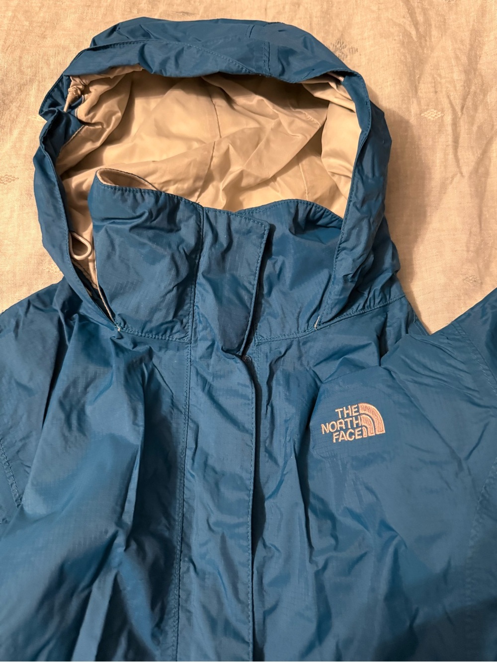The North Face Women’s Medium Blue Hooded Raincoat with Cream Lining